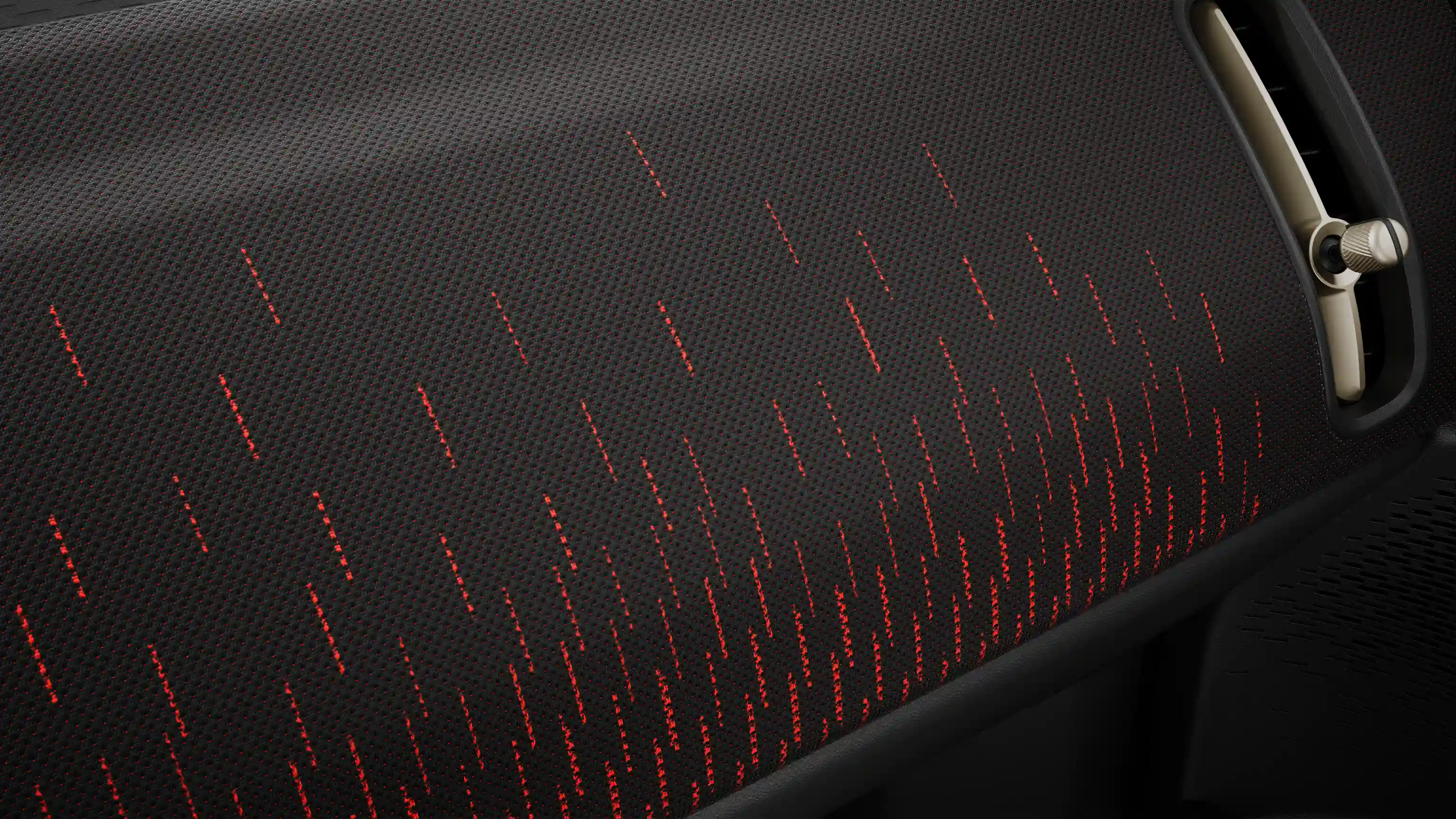 Billede af det røde og sorte instrumentbræt i den fuldelektriske MINI Countryman JCW