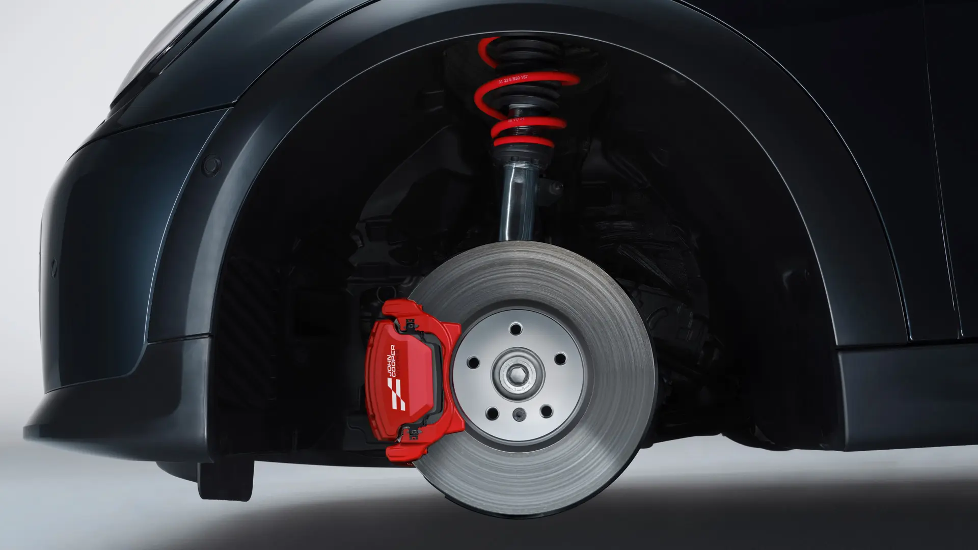 MINI John Cooper Works-sportsaffjedring med fjedre i John Cooper Works Chili Red.